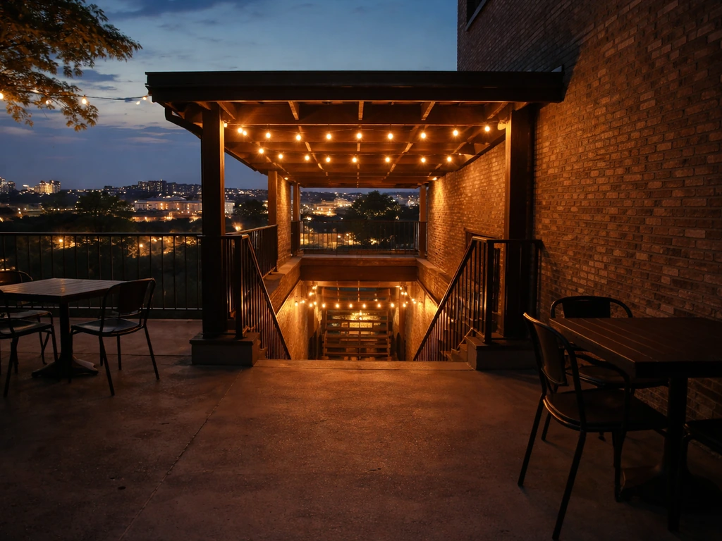 Warm evening view from a rooftop terrace looking down toward a gastropub patio connection
