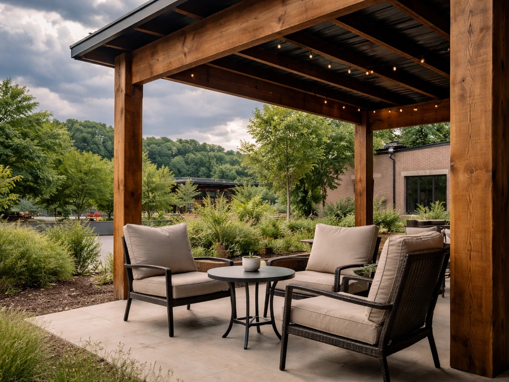 Covered brewery patio with shaded posts and comfortable seating under stormy June skies.
