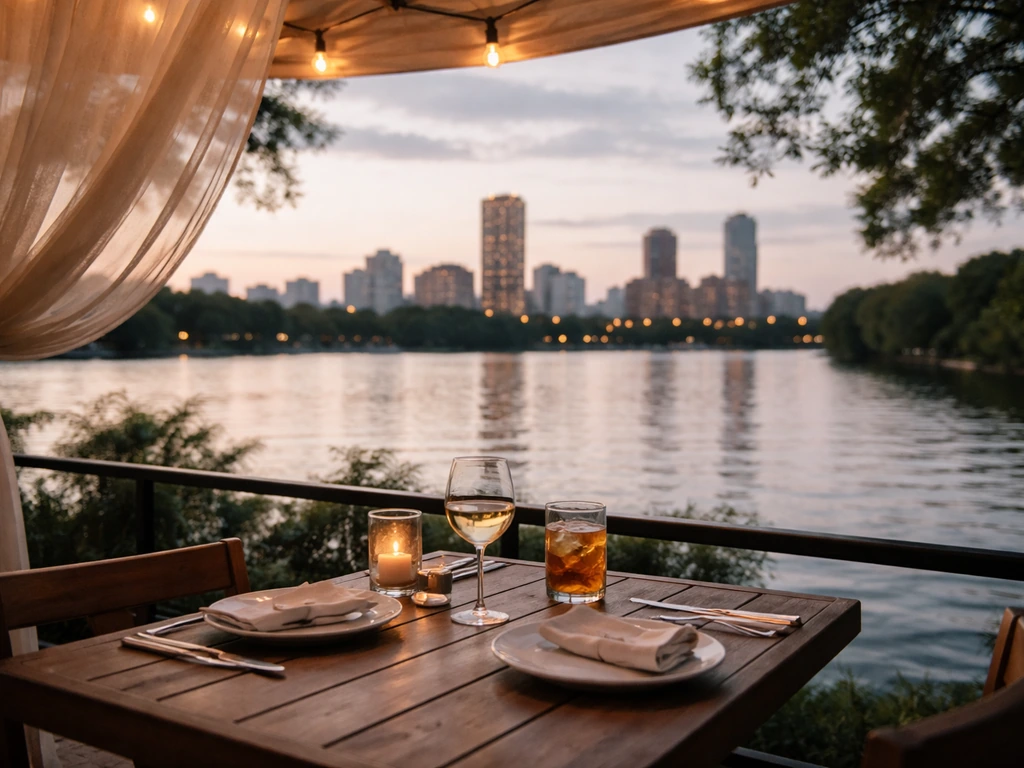 Patio dining with river and downtown skyline view through open space, emphasizing scenic ambiance.